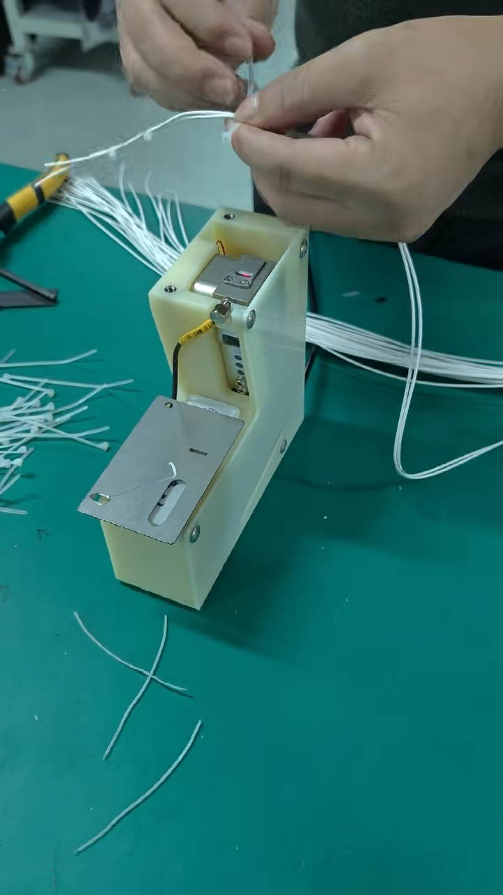 Máy căng và cắt dây rút tự động (kích hoạt cảm ứng) JW-SLQ